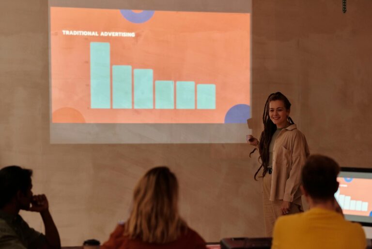 Young professional presenting data with graph in a business meeting.